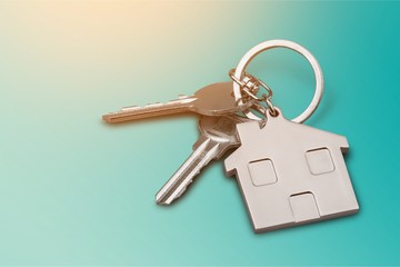 House keys with house figure  on background