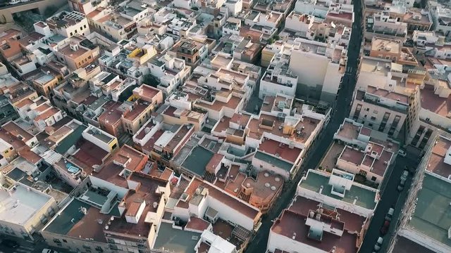 Aerial view of residential area roofs and narrow streets in Almeria, Spain