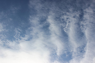 Cloud formation composition sun overcast white grey blue repetition lines streaks deep