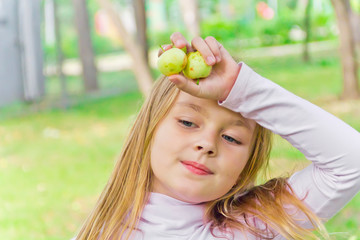 Cute girl with apples