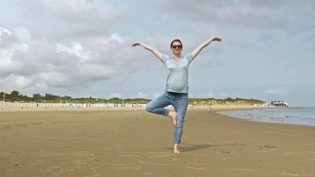 Pregnant Woman Posing on Beach Sands