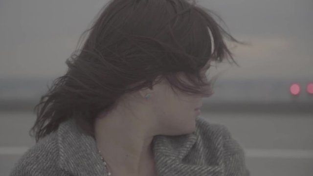 Cute girl turns her head from left to right. Slow motion, s-log, ungraded