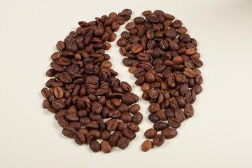 Coffee beans laid in a shape of a big coffee bean.