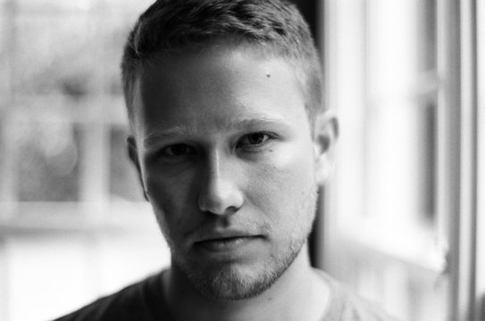 Black and white portrait of a handsome young man