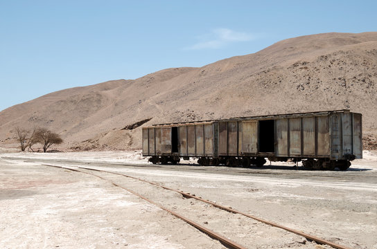 Abandoned old train carriage in the middle of the desert