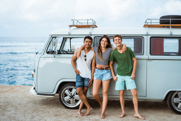 Group of young cheerful and smiling while leaning at retro style