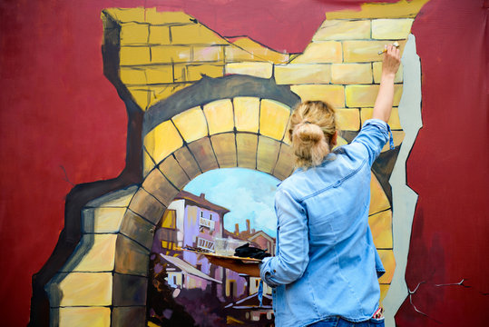 Young Woman Creating 3D Painting Outdoor