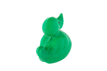 Image of old plastic baby toy green duck isolated on white background.