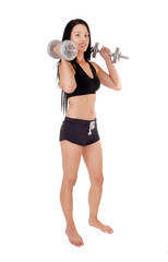 Woman workout whit two dumbbells smiling, bare feet