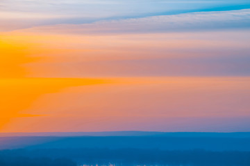 Varicolored striped surreal sky with shades of blue, cyan, pink, purple, magenta colors with cobalt...