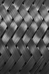 Metal wire braiding in macro. Detailed steel texture close up. Ideal metal background with copy space. Shiny template.