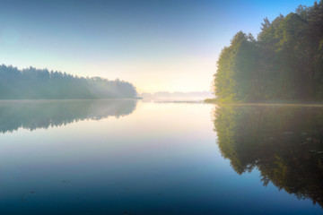 Fototapeta na wymiar quiet Masurian lake in autumn. Poland.