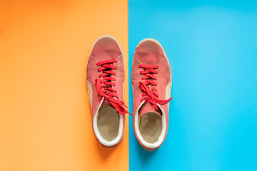 top view of pair canva sneaker shoes isolated on double color surface f