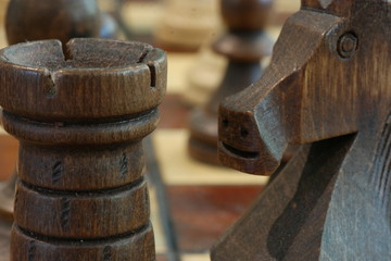 Hand made chess pieces macro Black rook and knight