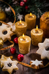 Fototapeta na wymiar Christmas candles with homemade cookies