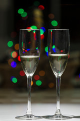 glasses of champagne, in the background points of color