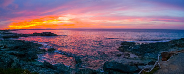 Fototapeta na wymiar Panoramic view of a stunning sunset in Formentera
