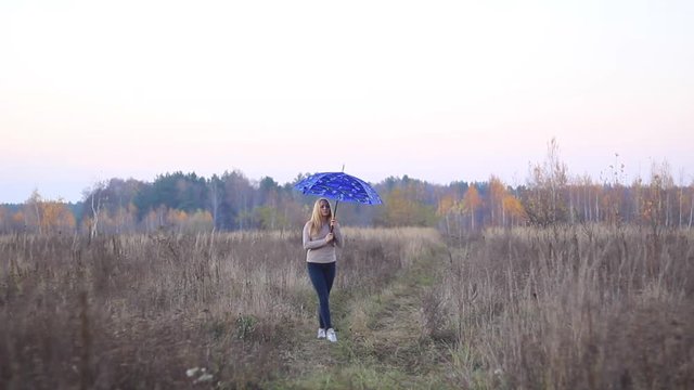 girl with umbrella on nature