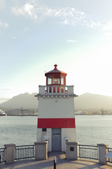 lighthouse shipping yard in background