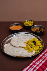 South Indian breakfast Dosa with sambar, chutney and aloo baji