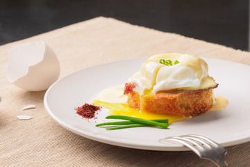 Breakfast is Eggs Benedict - toasted English muffins, bacon, ham, poached eggs, herbs and delicious buttery hollandaise sauce.