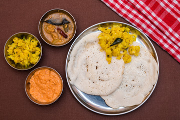 South Indian breakfast Dosa with sambar, chutney and aloo baji