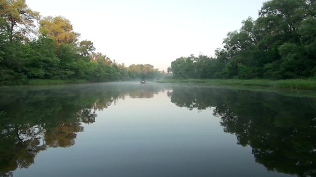 fly above motorboat at sunrise,aerial view of river at sunrise 4K, river in morning mist, Very high view of the river forest at sunrise, Aerial view of mystical river at sunrise with fog