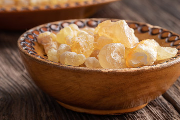 Frankincense resin in a bowl on a table