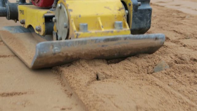 The Foundation is poured with concrete from a pipe, a close - up of the concrete mixture. The concept of the construction.