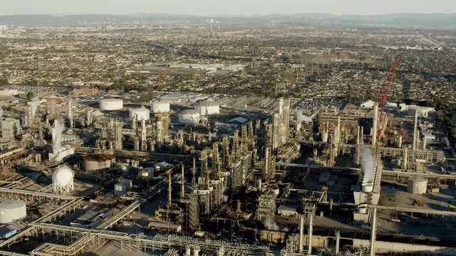 Aerial view of fossil fuel refinery Los Angeles cityscape USA