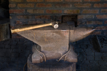 antique anvil with a hammer