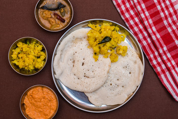 South Indian breakfast Dosa with sambar, chutney and aloo baji