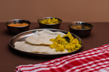 South Indian breakfast Dosa with sambar, chutney and aloo baji