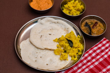 South Indian breakfast Dosa with sambar, chutney and aloo baji