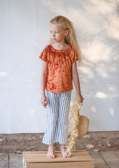 portrait of little girl outdoors in summer