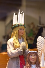 Swedish Christmas figure with candle crown on the head of Saint Lucia, a Christian martyr that is...