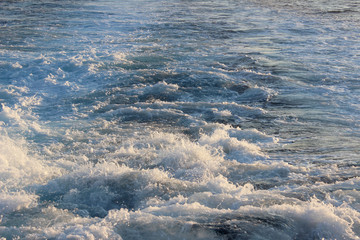 Blue ocean sea fast boat foam spray detail motion abstract