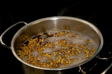 Lentils in a pot with boiling water