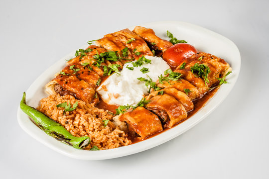 Turkish Beyti Kebab Served with Bulgur Pilaf and Yoghurt