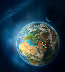 Syria from space on Earth surrounded by space with Moon and Milky Way. Detailed planet surface with city lights and clouds.
