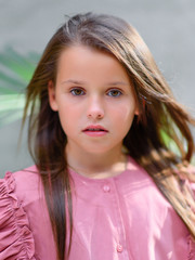 portrait of little girl outdoors in summer