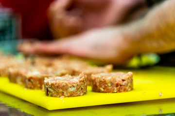 Male Chef Making Round Pork Cutlet for Some Burgers for  Wedding Meal