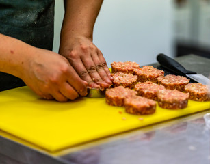 Female Chef Making Round Pork Cutlet for Some Burgers for  Wedding Meal