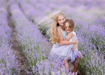 portrait of two sisters in a lavender field