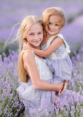 portrait of two sisters in a lavender field