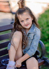 portrait of little girl outdoors in summer