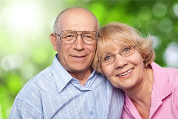 Portrait of happy senior couple smiling at home