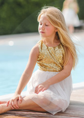 portrait of little girl outdoors in summer