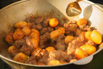 pilaf and other dishes in the cauldron. Methods and ingredients for cooking pilaf. Lamb and beef in Eastern cuisine