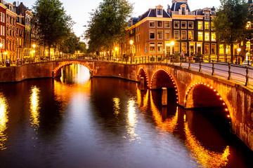 Beautiful night scene from the City of Amsterdam in the Netherlands with canals and lights